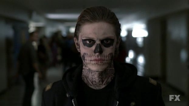 kids wanders into class wearing a fake skull tattoo on his face which he